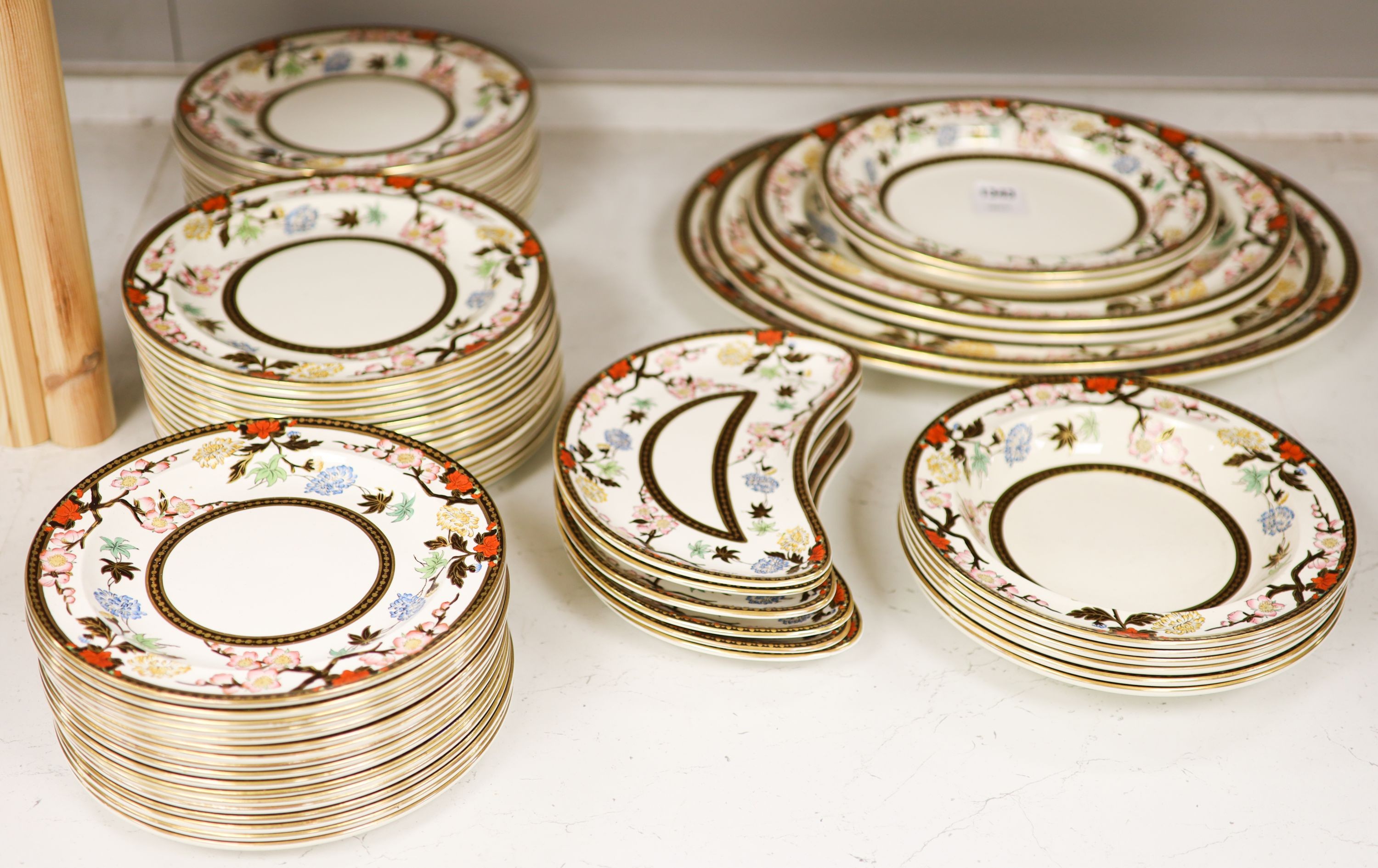 A Wedgwood Crescent pattern creamware part dinner service, the borders decorated with pink blossoms and chrysanthemums (approx. 65 pieces)